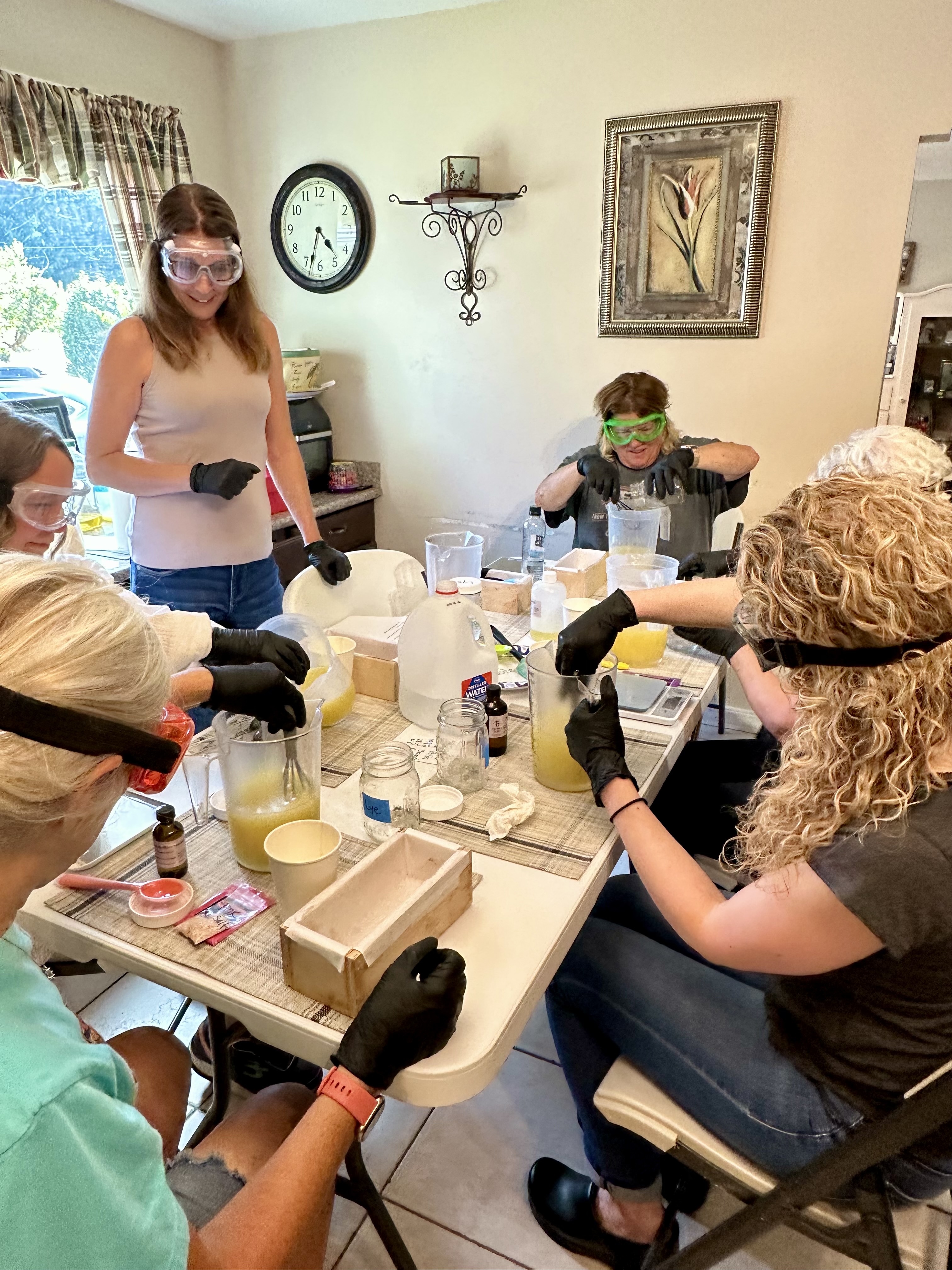 Guests in gloves and goggles pouring their soap loaves