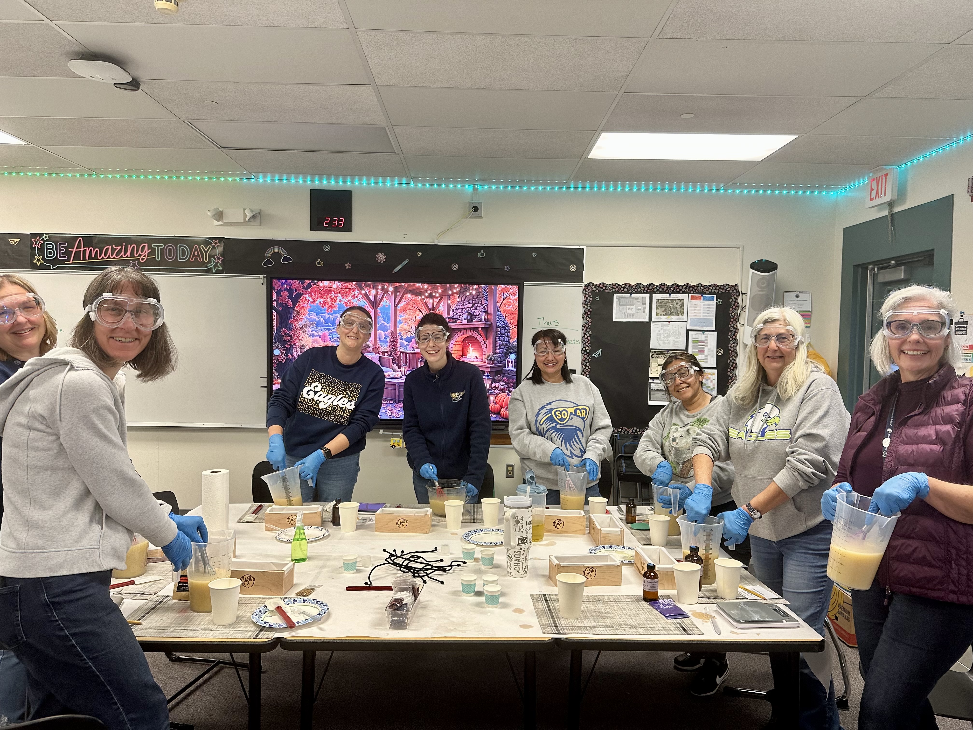 A workshop group holding their finished soap molds